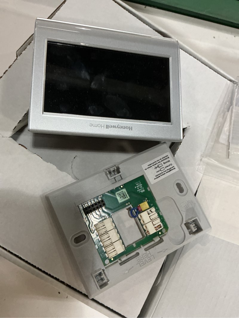 Condition photo showing As Is for honeywell home wi-fi smart color 7-day programmable smart thermostat with color-changing touchscreen display