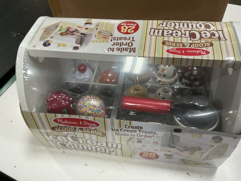 Condition photo showing New/Like New for melissa & doug wooden scoop & serve ice cream counter, pretend play store, 28 toy food & play kitchen accessories, preschool toys for girls & boys 3+ main