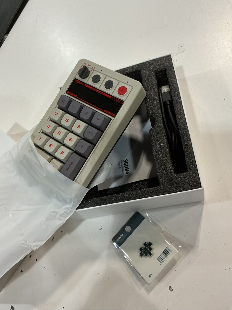 Condition photo showing Good Condition for 8bitdo 18 keys retro mechanical numpad, supports pc numpad & standard calculator mode, hot-swappable, pc calculator shortcut button, bluetooth/2.4g/wired numpad for windows and android - n edition