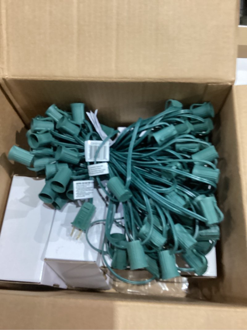 Condition photo showing Good Condition for Novelty Lights C9 Multicolor Ceramic Christmas String Lights - Indoor/Outdoor Light Set w/ 125 Opaque Bulbs for Christmas Tree, Patio, Wedding Decor, and More - (Green Wire, 100' Long)