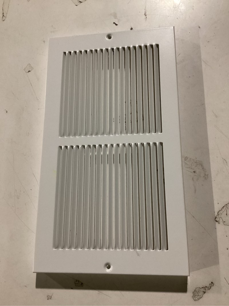 Condition photo showing As Is for reliabilt 12-in x 6-in steel white baseboard grille ( outside width- 13.57-in )