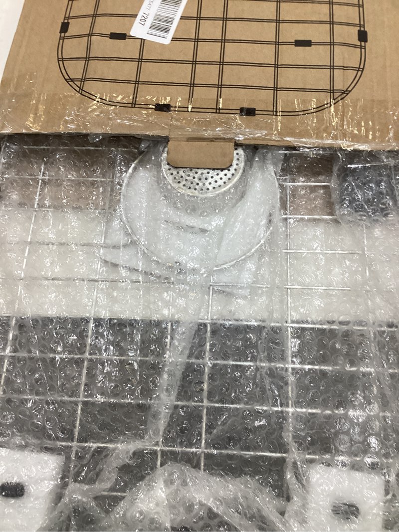 Condition photo showing As Is for Kitchen Sink Grid 26-1/8"x14-1/4 - Heavy Duty Kitchen Sink Protector with Built-in Strainer & Center Drain, Non-Slip Rubber Feet & Scratch Resistant Bottom Guard Center Drain 26.12 x 14.25