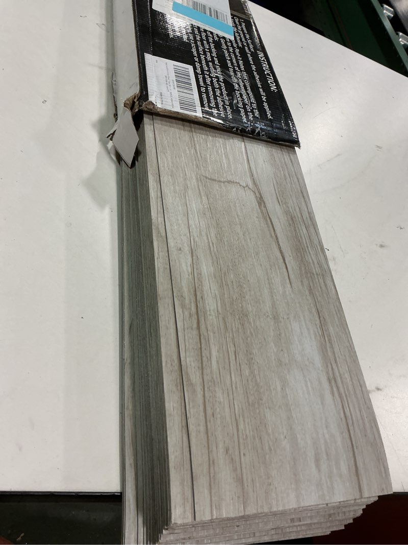 Condition photo showing Good Condition for 54 Sq.Ft. Peel and Stick Vinyl Floor Tiles 36" x 6" Wood Look Planks, 36 Pack Waterproof Self-Adhesive Flooring Tiles, DIY for Renter, Kitchen, Living Room, RV, Washed White