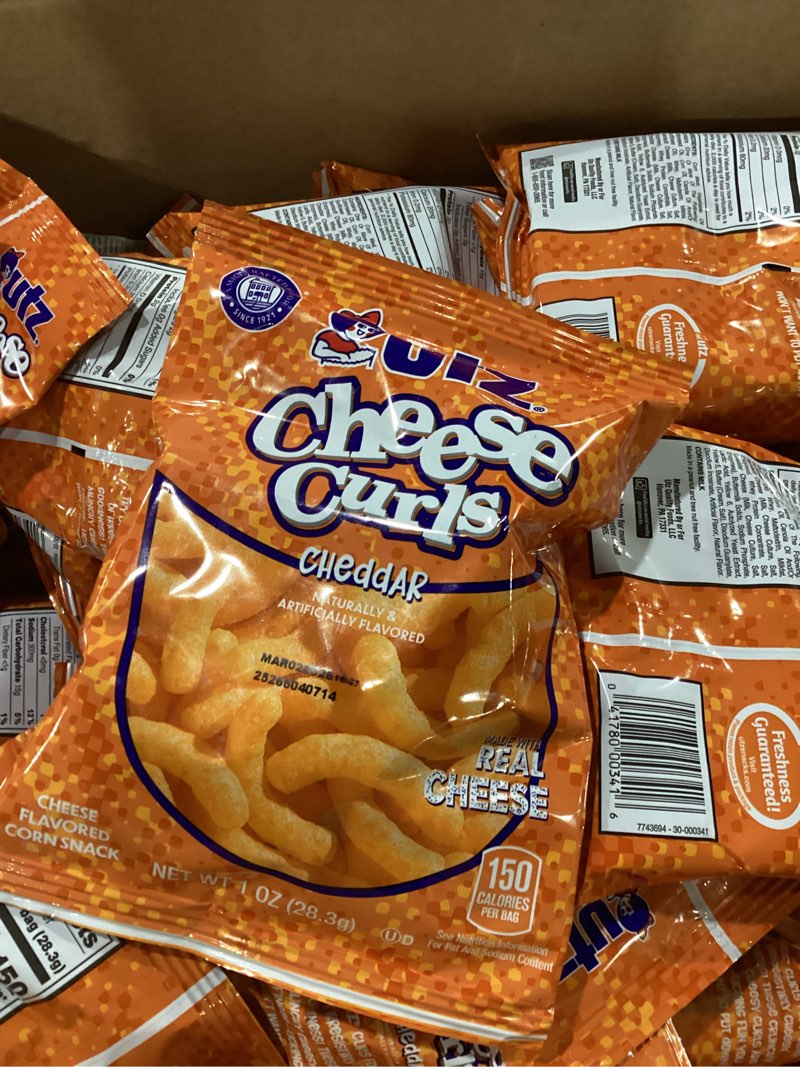 Condition photo showing As Is for best buy 3/2/26****utz baked cheddar cheese curls  multipack  1 oz  60 count
