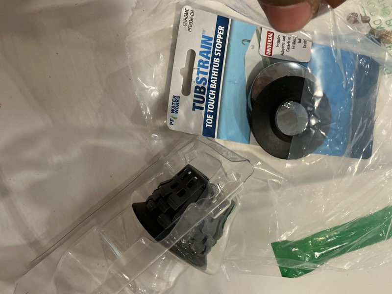 Condition photo showing Good Condition for universal toe touch (tip toe, foot actuated) bath tub/bathtub drain stopper includes 3/8" and 5/16" fittings chrome with hair catcher