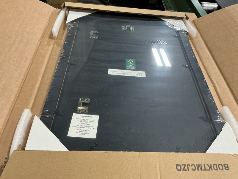 Condition photo showing New/Like New for amazon basics rectangular wood poster frame, 12" x 18", black