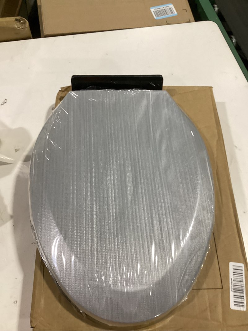 Condition photo showing Good Condition for renovators supply manufacturing black plastic soft close elongated toilet seat quiet-close lid, contoured seat easy to install and clean, grip-tight bumpers with adjustable mounting hardware