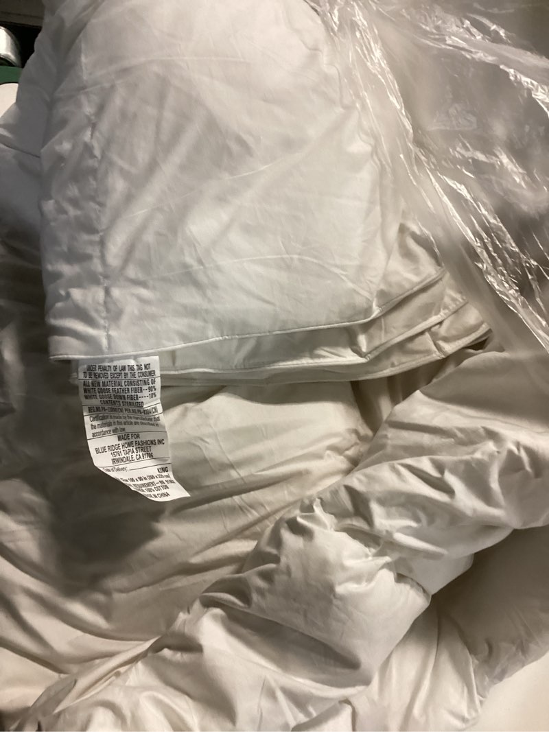 Condition photo showing As Is for WhatsBedding Feather Down Fiber Comforter King Size,Duvet Insert King Filled with Feather and Down Fiber, All Season White Luxury Bed Comforter,Ultra Soft 100% Cotton 106"x90" White King