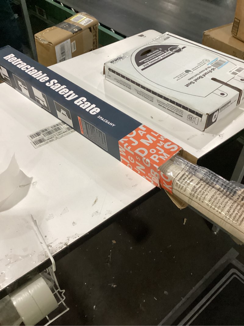 Condition photo showing New/Like New for Retractable safety gate