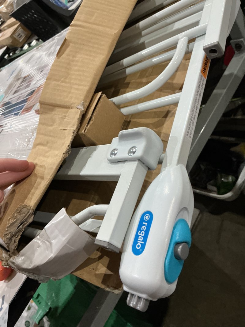 Condition photo showing As Is for regalo safety 29-38.5" baby gate for doorways & bottom of stairs, pressure mounted baby gate with door for babies, toddlers & pets, tested & safe for 30 years, american designed, american owned, white white 29-38.5"w x 30"h