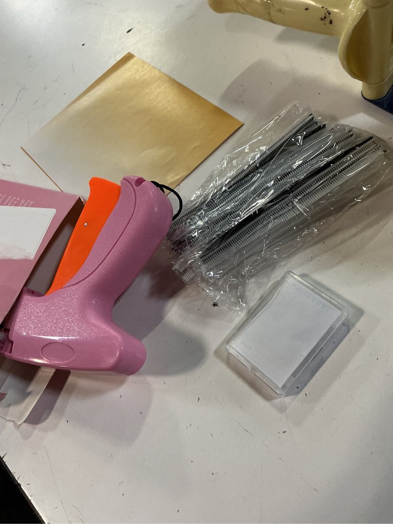 Condition photo showing Good Condition for stitch gun for clothes - handheld stitch gun quick clothing fixer - tagging gun - includes 6 needle, 1000 black fasteners & 1000 white fasteners pink,orange