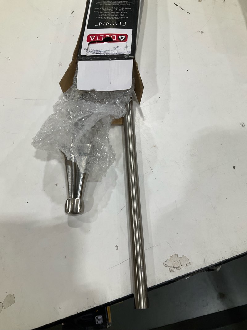 Condition photo showing As Is for delta flynn 18-in or 24-in adjustable brushed nickel wall-mount single towel bar