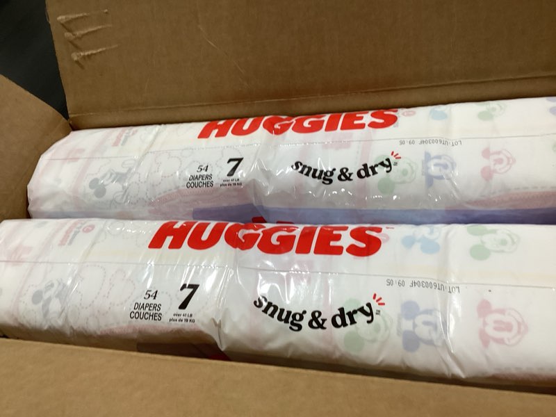 Condition photo showing New/Like New for Huggies Size 7 Diapers, Snug & Dry Baby Diapers, Size 7 (41+ lbs), 108 Count (2 Packs of 54), Packaging May Vary Size 7 108
