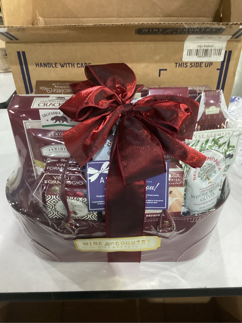 Condition photo showing As Is for expiration date jul/19/2025**** wine country gift baskets gourmet feast perfect for family friends co-workers loved ones and clients