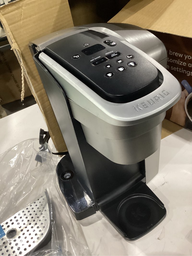 Condition photo showing As Is for Keurig K-Elite Single Serve K-Cup Pod Coffee Maker, with Strength and Temperature Control, Iced Coffee Capability, 8 to 12oz Brew Size, Programmable, Brushed Silver (NOT TESTED)
