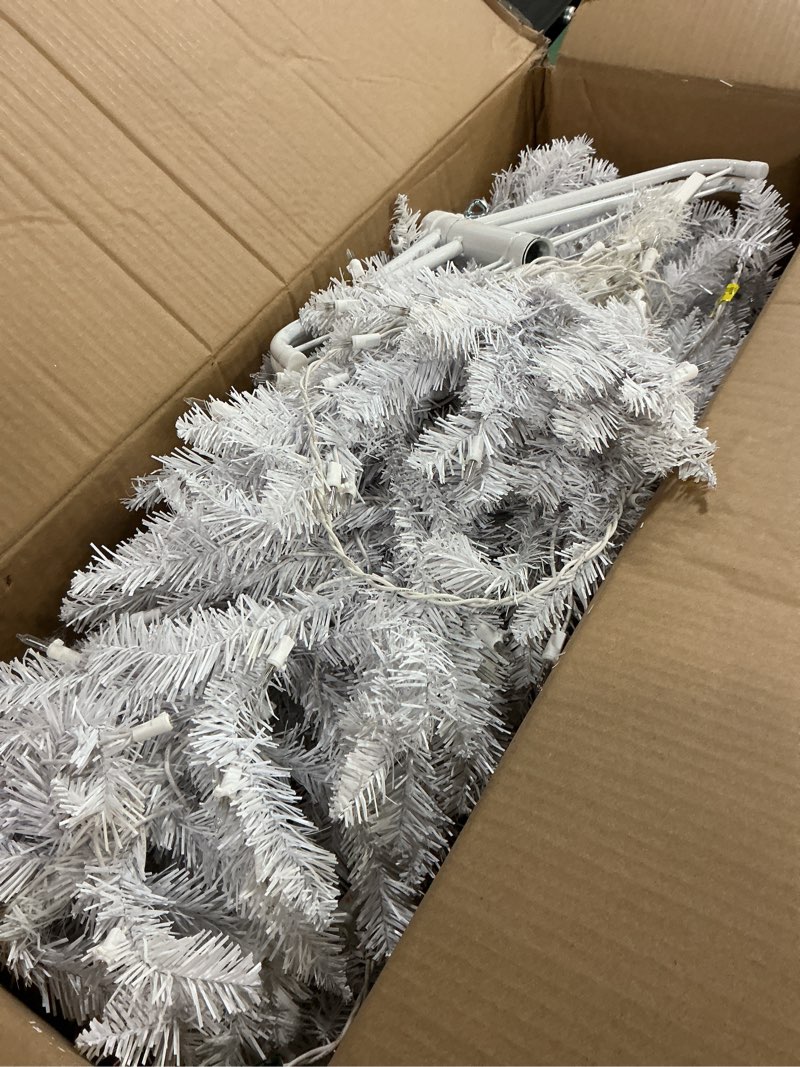 Condition photo showing As Is for national tree company artificial pre-lit slim christmas tree, white, kingswood fir, white lights, includes stand, 7 feet 7ft tree