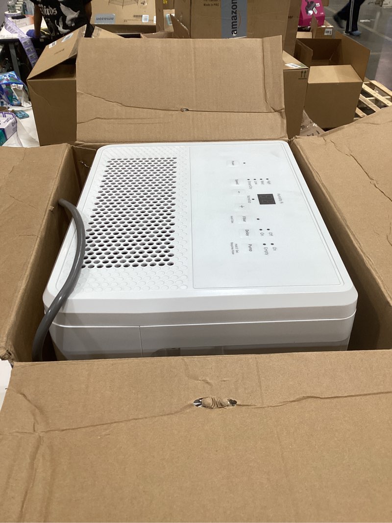 Condition photo showing As Is for ge portable dehumidifier, 50 pint daily output with built-in pump and smart dry for wet spaces auto or manual drainage, ultra quiet, perfect for basement, bedroom, bathrooms, white 50 pint - pump