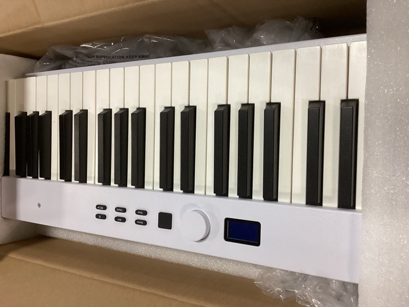 Condition photo showing Good Condition for KONIX Folding Piano Keyboard, 88 Key Full Size Semi Weighted Foldable Keyboard Piano, Portable Bluetooth Electric Piano with Sheet Music Stand, Sustain Pedal and Piano Bag, White