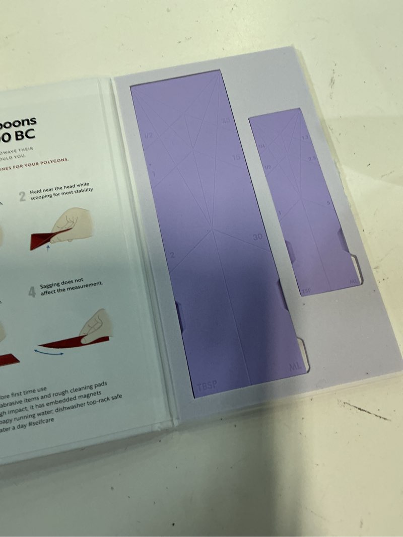Condition photo showing As Is for (color purple)polygons - original flat 3-in-1 folding measuring spoons | 2 spoons fold into 6 sizes | magnetic | durabend tech lasts 100k+ folds | leakproof for wet & dry | gift packaging | baking/cooking (blue) 2. blue