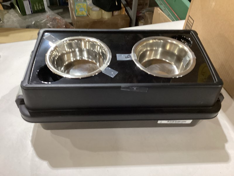 Condition photo showing New/Like New for IRIS USA 2-in-1 Elevated Dog Bowls 6" H with Airtight Pet Food Storage Container Holds Up to 5 Lbs, Removable 4 Thick 16 oz Stainless Steel Bowls, at Home or Camping Pet Dish Bowl Set, Smoke/Black