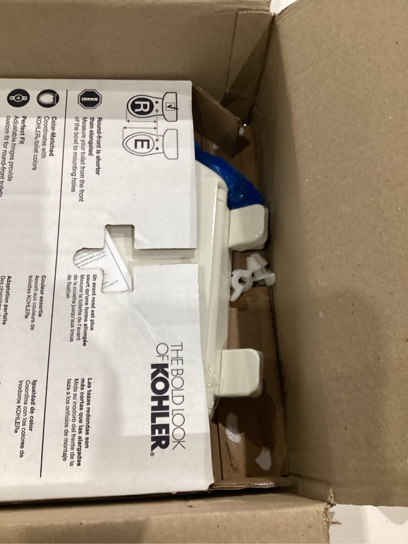 Condition photo showing As Is for kohler 20111-96 brevia, slow close toilet seat, round toilet seat, grip-tight bumpers quick-attach hardware, biscuit biscuit round quiet-close