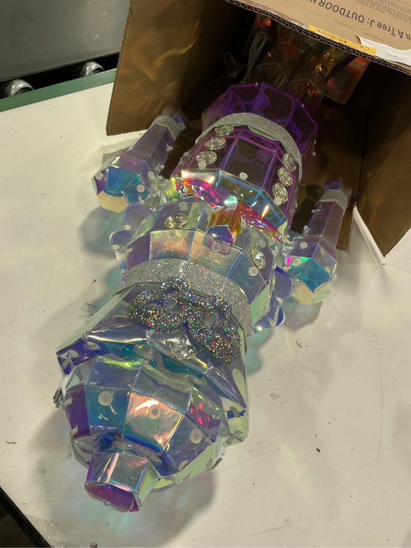 Condition photo showing As Is for LW415-PXFG011B HL SMALL IRDESCENT NUTCRACKER