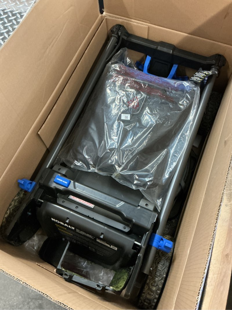 Condition photo showing As Is for kobalt 48v max (24vx2) 21-in push mower kit, (2) 5.0ah batteries and charger included