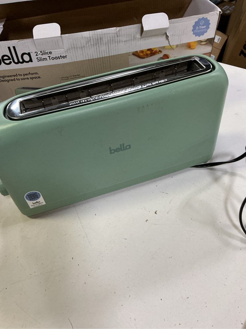 Condition photo showing As Is for bella 2 Slice Slim Toaster, Fits-anywhere™ Kitchenware, 6 Setting Shade Control with Reheat & Cancel Buttons, Removable Crumb Tray, 10” Long Slot, Anti Jam & Auto Shutoff, 900 Watt, Seaglass