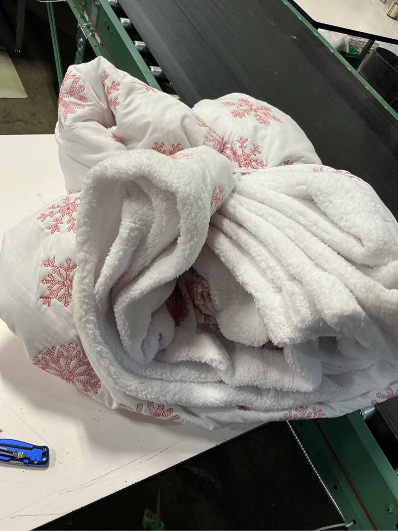 Condition photo showing As Is for red snowflake 3-piece white, red, cream snowflake reverse to sherpa full/queen quilt set
