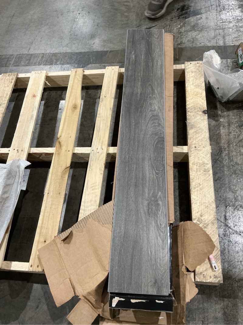 Condition photo showing New/Like New for msi mckenna 7 in. x 48 in. luxury vinyl flooring, rigid core planks, lvt tile, waterproof lvt, wood grain finish, plaza gray-dark, 12 mil wear layer, 5 mm thick,23.77 sq.ft/case plaza gray-dark 7 in. x 48 in. case