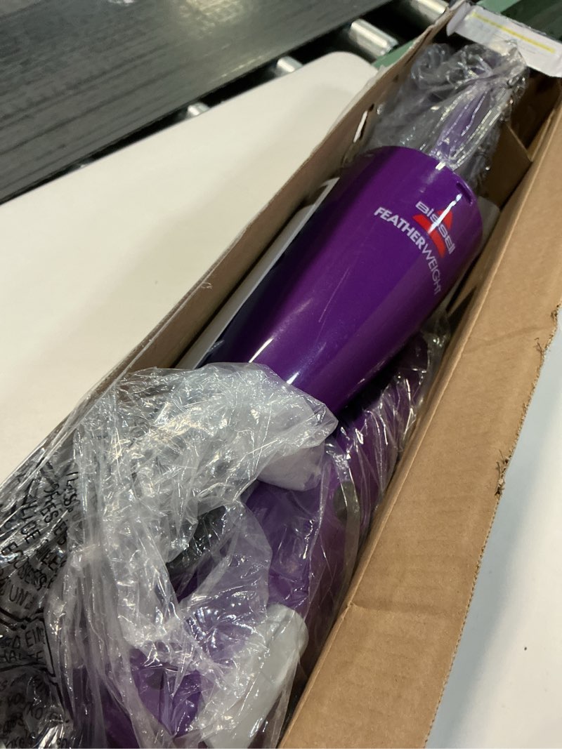 Condition photo showing As Is for Bissell Featherweight Stick Lightweight Bagless Vacuum with Crevice Tool, 20334, Purple