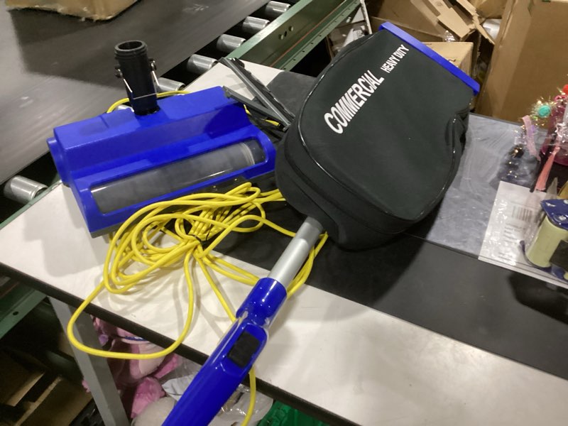 Condition photo showing As Is for amazon basics heavy duty upright bagged vacuum