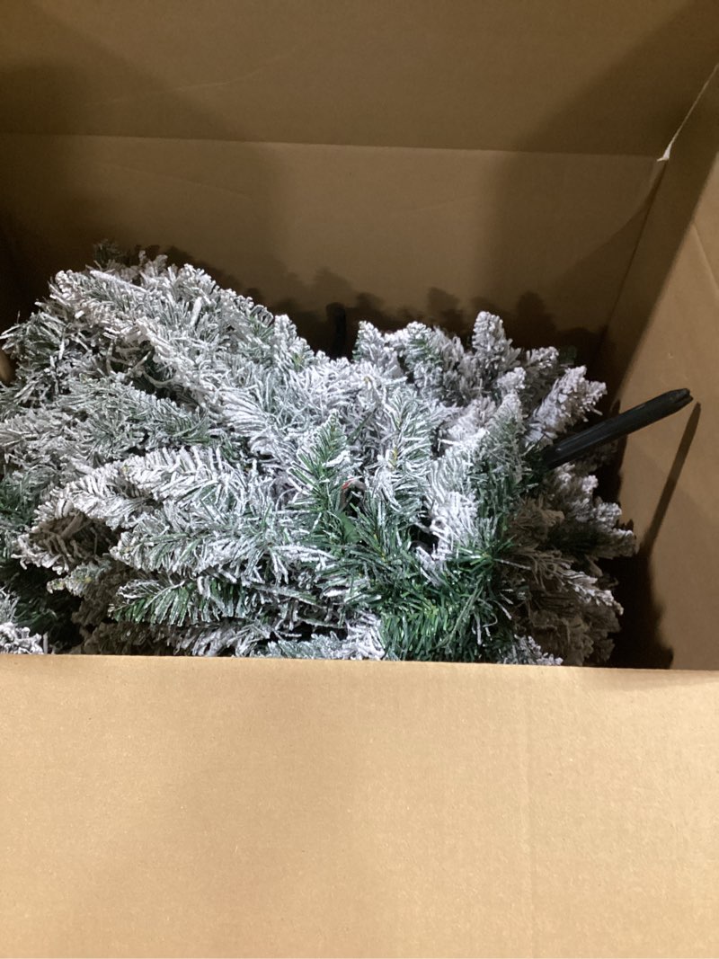 Condition photo showing item condition for 6 FT Pre-lit Snow Flocked Christmas Tree, Artificial Christmas Tree with 250 Warm White & Color LED Changing Lights, 600 PVC Branch Tips, Easy Assembly/Metal Stand/Hinged/8 Color Modes PVC Color Cleae LED 6ft