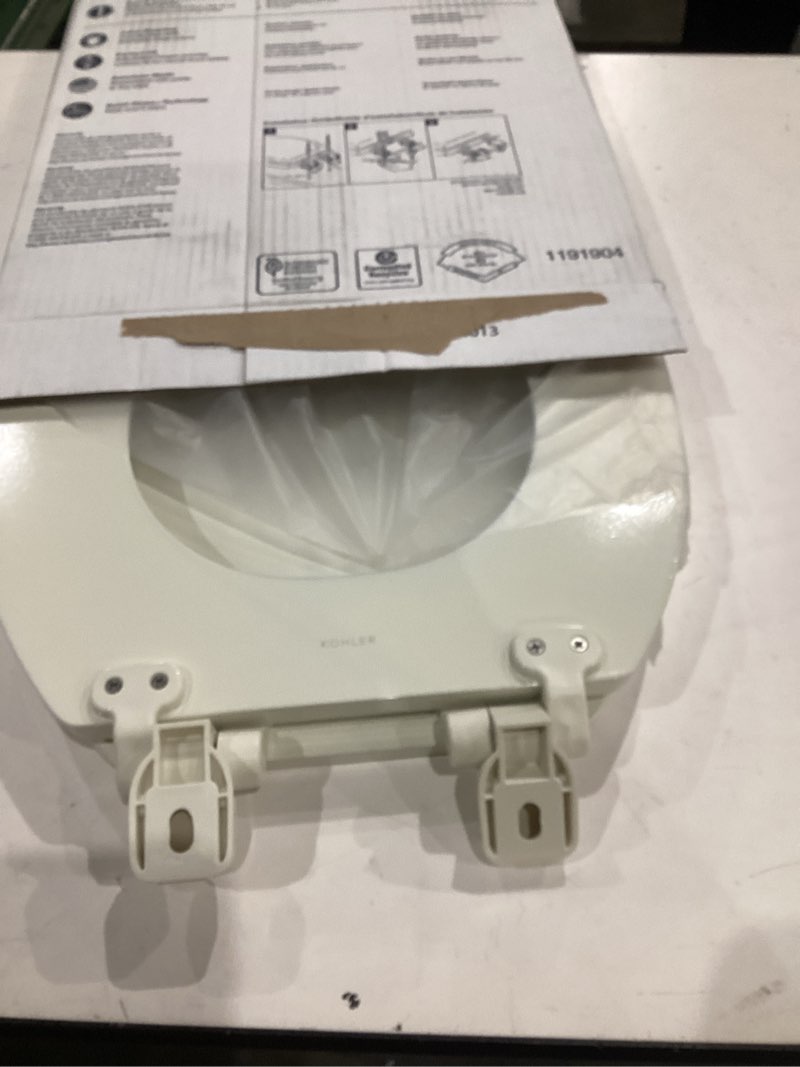 Condition photo showing As Is for " kohler 20455-96 ridgewood round soft close toilet seat, quiet-close, wood toilet seat, home essentials, biscuit"