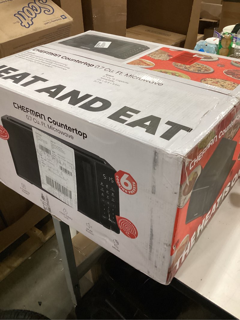 Condition photo showing New/Like New for Chefman Countertop Microwave Oven 0.7 Cu. Ft., 700 Watts with 10 Power Levels, 6 Cooking Presets with One-Touch Express Cook, Eco Mode, Child Safety Lock, & Mute Button - Black