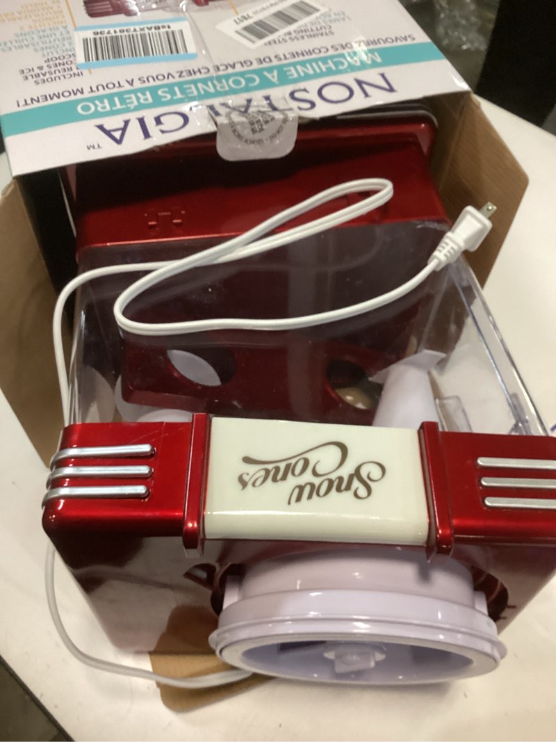 Condition photo showing As Is for Nostalgia Snow Cone Shaved Ice Machine - Retro Table-Top Slushie Machine Makes 20 Icy Treats - Includes 2 Reusable Plastic Cups & Ice Scoop - Retro Red Table Top Metallic Red