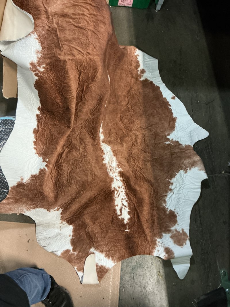 Condition photo showing New/Like New for benron premium faux cowhide rug, cow print, rustic western rugs for living room bedroom, irregular animal skin hides, 4.6 x 5.2ft, anti-skid cool carpets for cowboy cowgirl home decor, khaki brown 4'7" x 5'2" (irregular) caramel