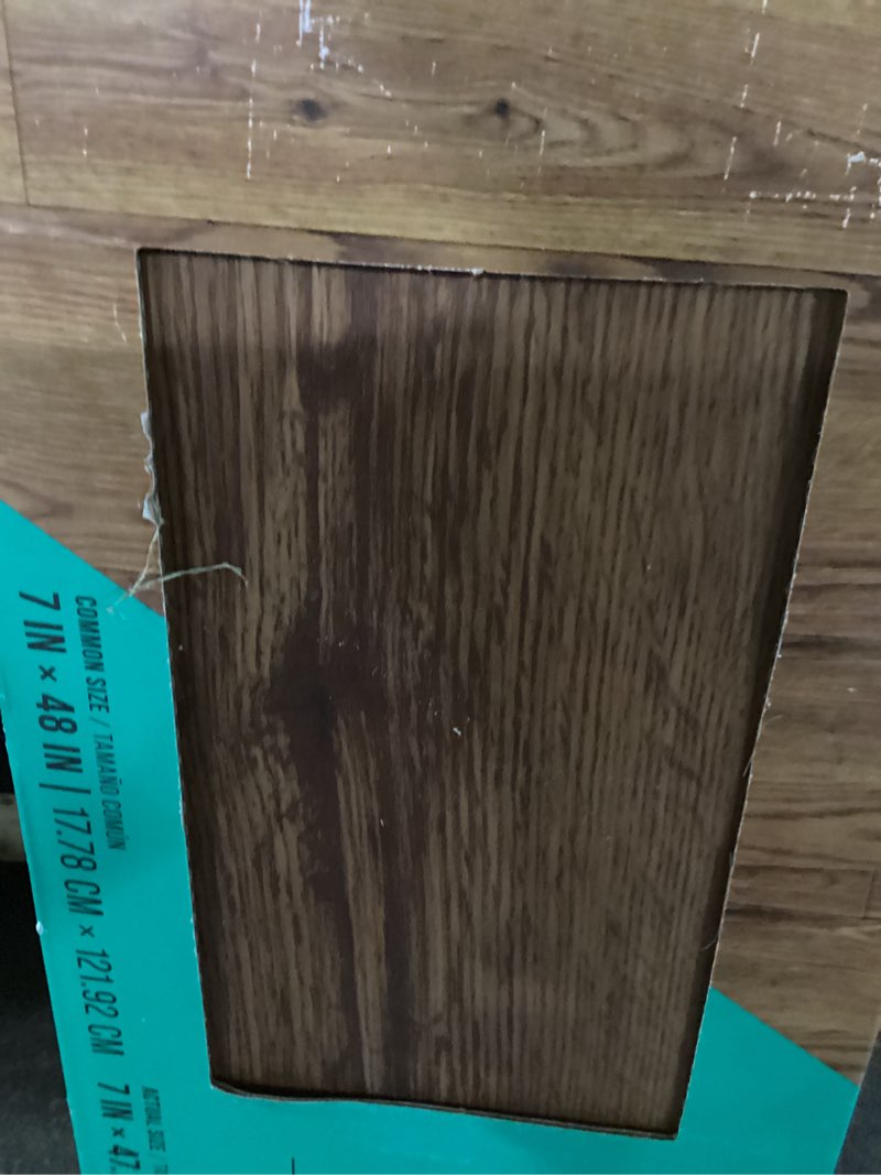 Condition photo showing As Is for stainmaster petprotect honeycomb brown 20-mil x 7-in w x 48-in l waterproof interlocking luxury vinyl plank flooring (18.57-sq ft/ carton)
