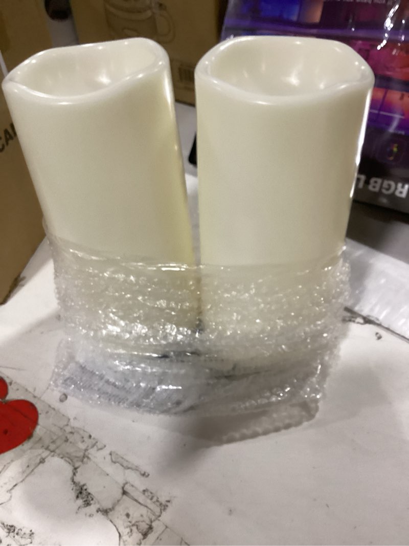 Condition photo showing Good Condition for genswin waterproof outdoor flameless candles battery operated with remote timer, 4" x 8" large led pillar candles flickering for indoor outdoor lanterns, long-lasting, waterproof (white, set of 2) 4"x 8"