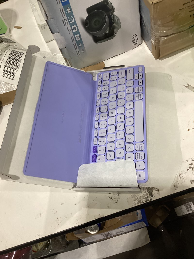 Condition photo showing As Is for Logitech Keys-to-GO 2 Portable Bluetooth Tablet Keyboard with Built-in Cover, Slim & Compact Wireless Keyboard for Windows, Android, Linux, iPad, iPhone, Mac, Apple TV - Lilac Keys-To-Go 2 Universal Lilac