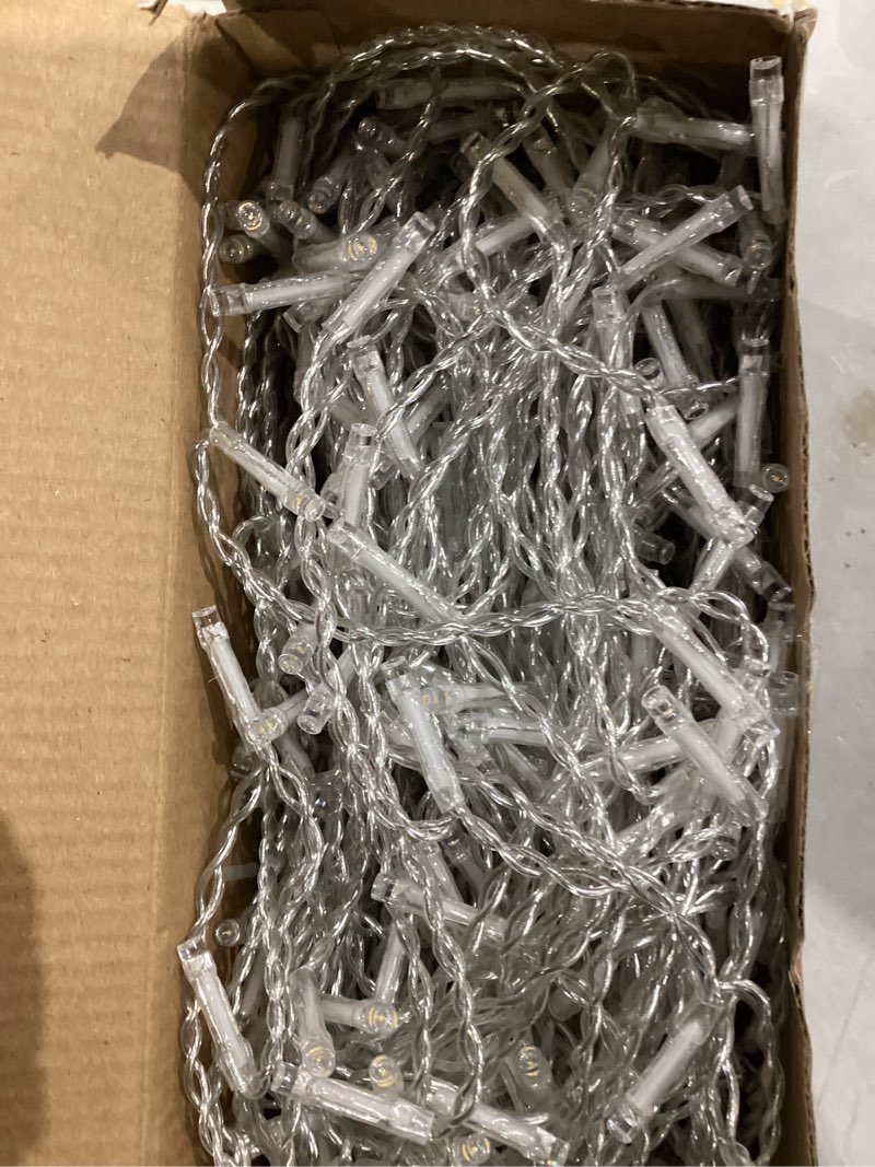 Condition photo showing Good Condition for jmexsuss 38.8ft icicle lights for outside, 400 led icicle christmas lights outdoor indoor plug in, warm white string lights for christmas house patio party fireplace holiday decorations warm white 38.8ft