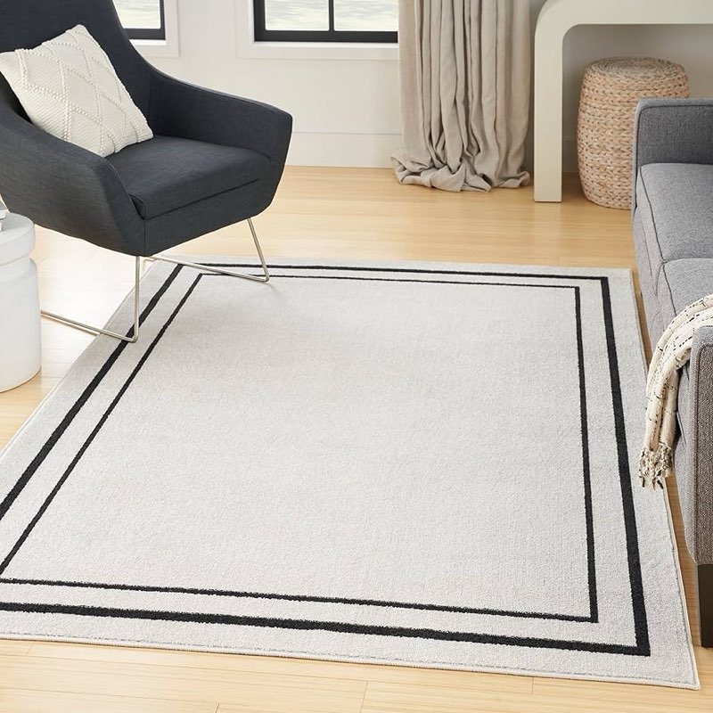 Nourison Essentials Ivory Black Indoor/Outdoor Area Rug 6*9”