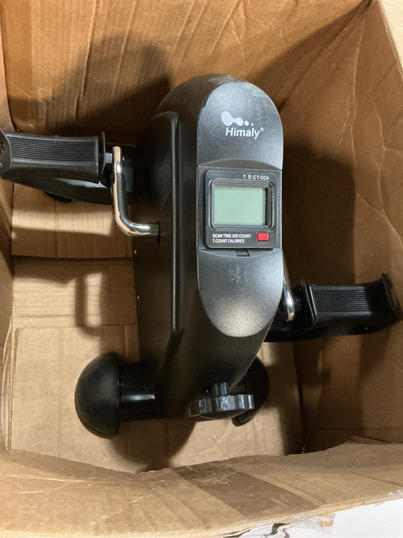 Condition photo showing As Is for mini exercise bike, himaly under desk bike pedal exerciser portable foot cycle arm & leg peddler machine with lcd screen displays black