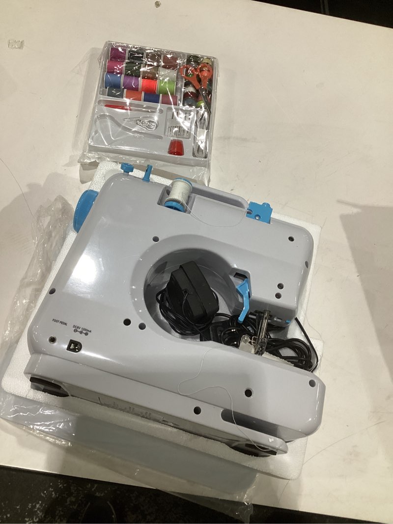 Condition photo showing As Is for sewing machine 505 for beginners with extension table and 42pcs sewing kit (white and blue)