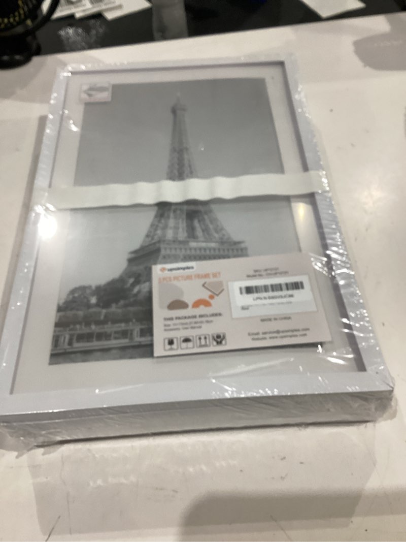 Condition photo showing New/Like New for upsimples 11x17 picture frame set of 5, display pictures 9x15 with mat or 11 x 17 without, wall gallery poster frames, white white 11x17