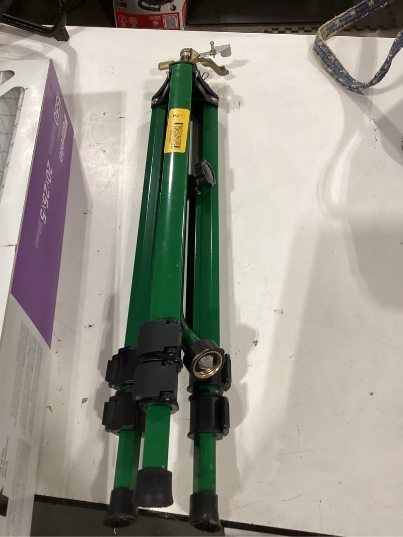 Condition photo showing As Is for green swivel tripod