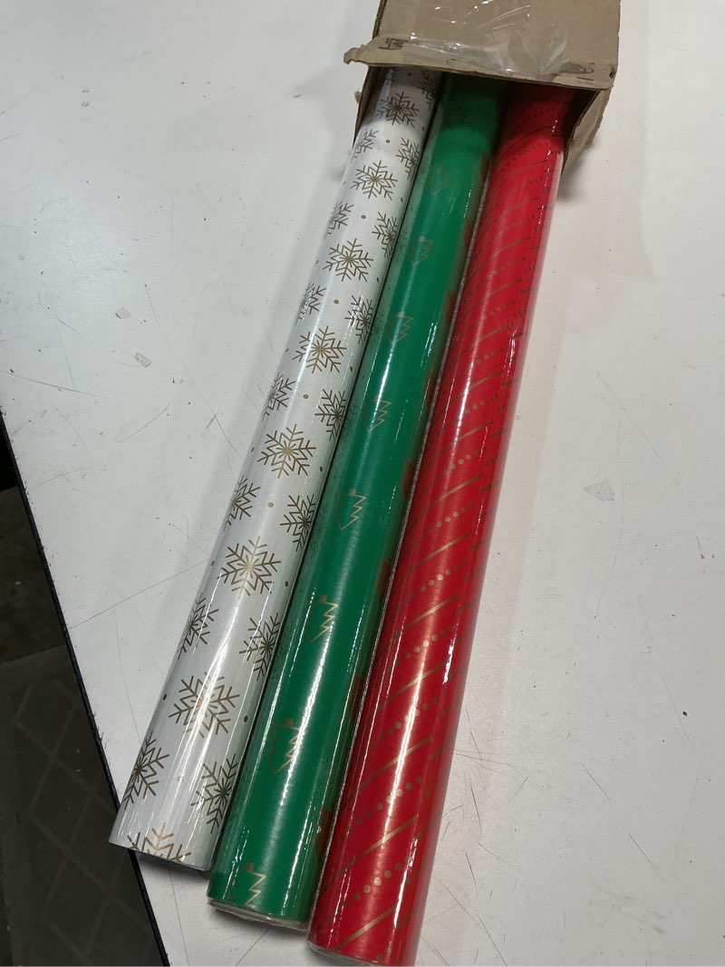 Condition photo showing As Is for Hallmark Red, Green, Gold Christmas Wrapping Paper Set (90 sq. ft. ttl, 10 Bows, 4 Ribbon Colors, 40 Gift Tag Stickers) Stripes, Snowflakes, Trees Red, Green and Gold