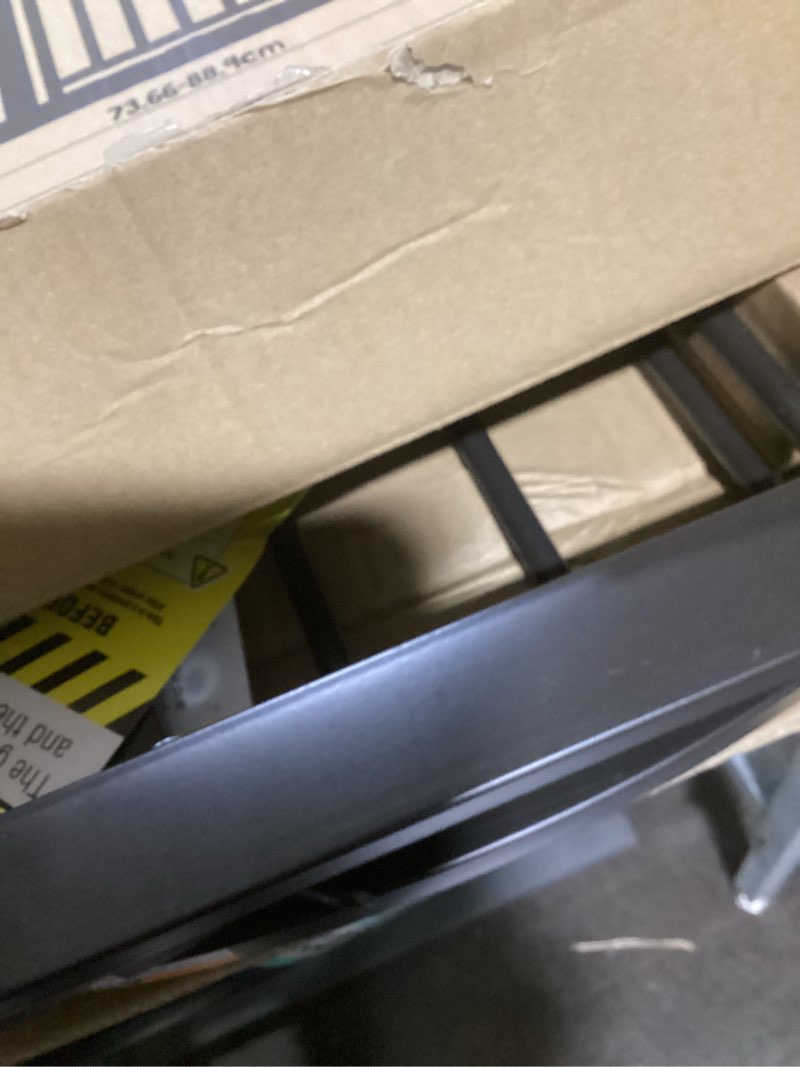 Condition photo showing Good Condition for regalo 35-inch home accents super wide walk through baby gate, includes 4-inch, 8-inch and 12-inch extension, 4 pack of pressure mounts and 4 pack of wall cups and mounting kit bronze - 29-35"w x 30"h