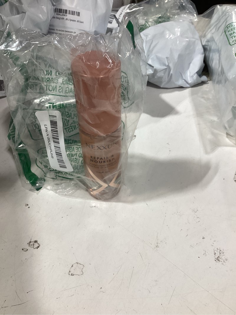 Condition photo showing Good Condition for nexxus styling hair care hair oil repair & nourish ultra lightweight hair oil, powered by styleprotect technology 4 oz