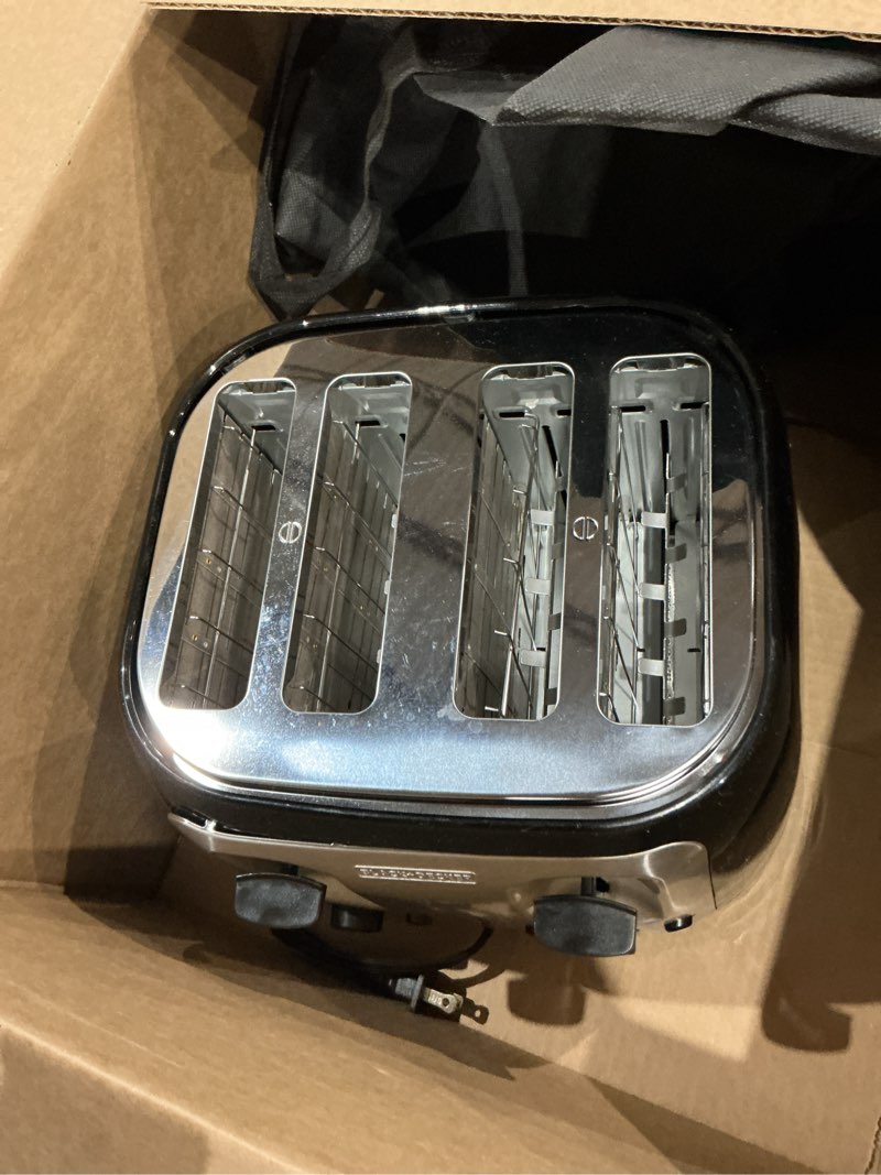 Condition photo showing As Is for black+decker 4-slice toaster, extra wide slots, 7 shade settings, 1400 watts, frozen and bagel buttons, toast shade selector, extra lift 4-slice black